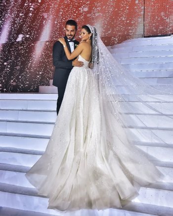 ملكة جمال لبنان بيرلا حلو تخطف الأضواء بزفافها المميز ومعرفة هوية العريس -صور
