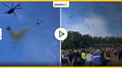 بالفيديو|| ممثل تشيكي يلقي مليون دولار في الهواء من مروحية ..السماء تمطر أموالا